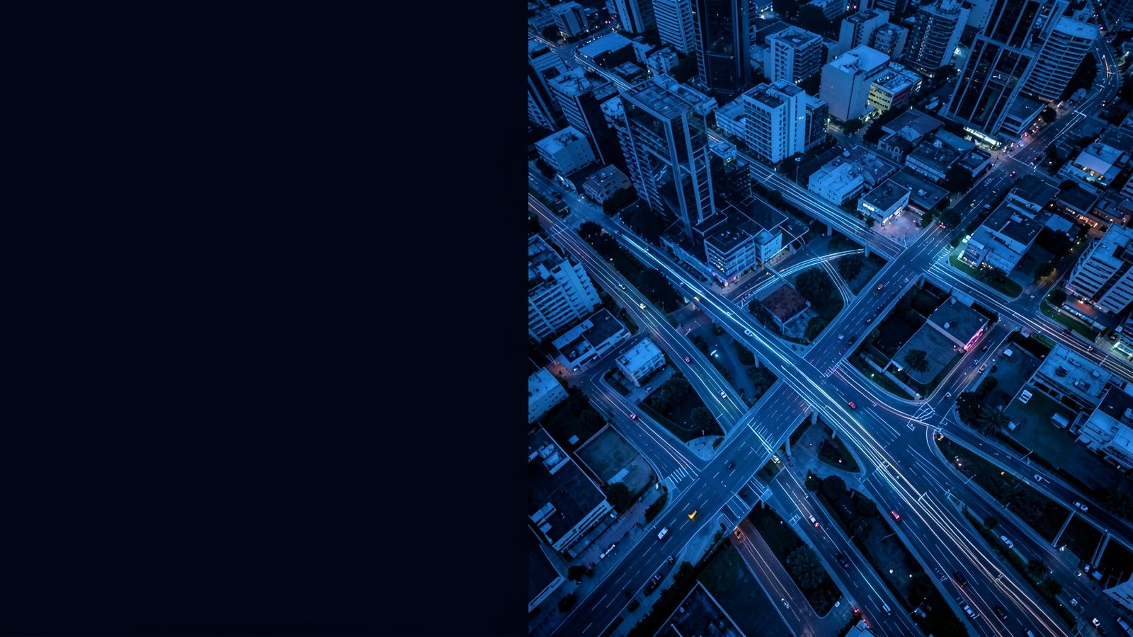 Aerial view of intersecting city roads at blue hour